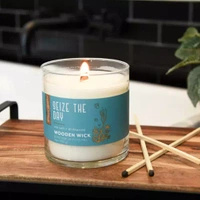 Scented candle with wooden wick	Seize the Day Candle-lite